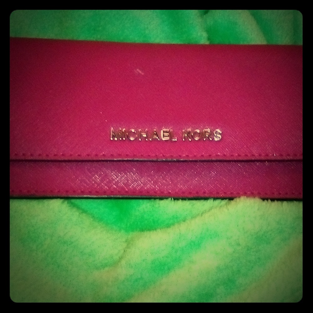Michael Kors pink saffiano leather wallet.